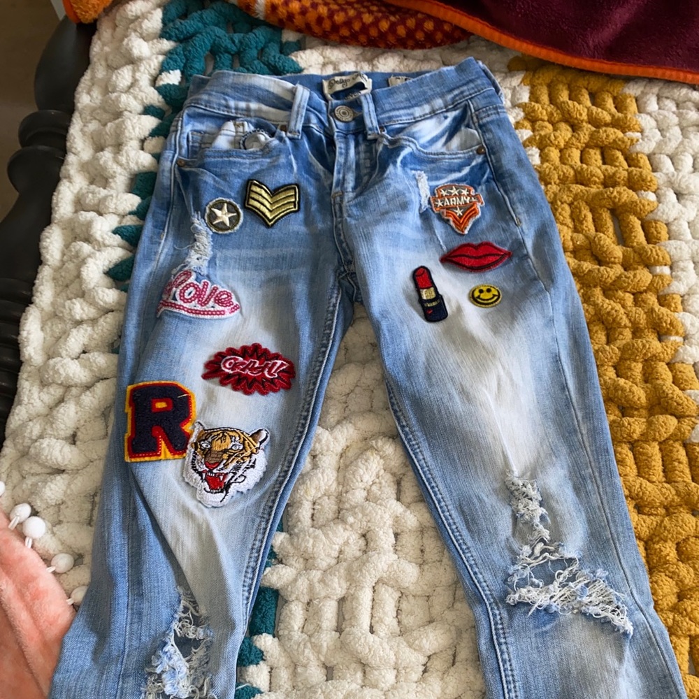 low rise ripped patched jeans